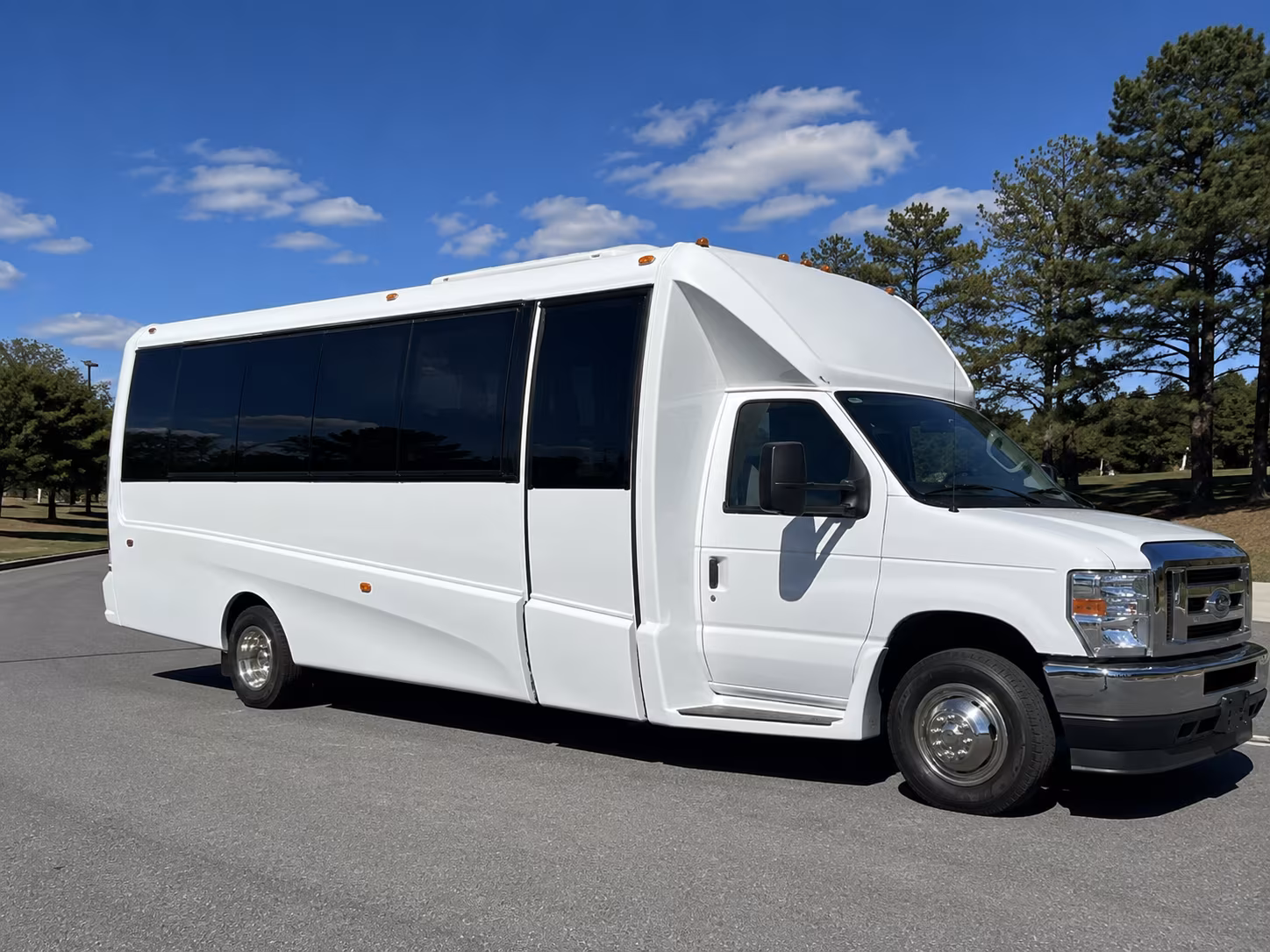Group beside a Mercedes Sprinter limo in Oklahoma City